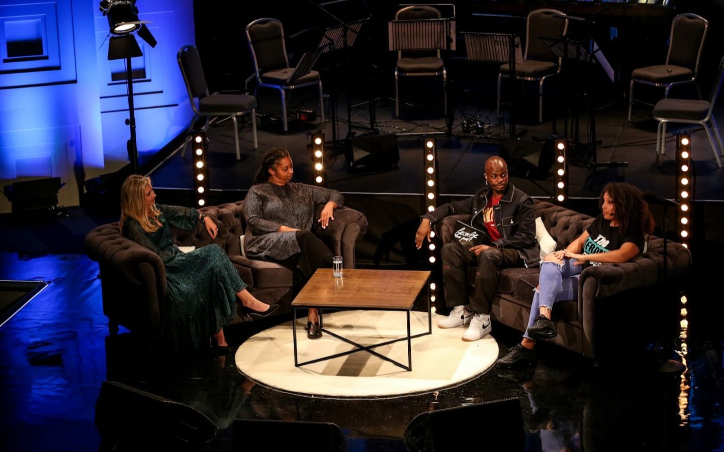 Holly Branson on stage with George the Poet at a BBC Sounds podcast recording