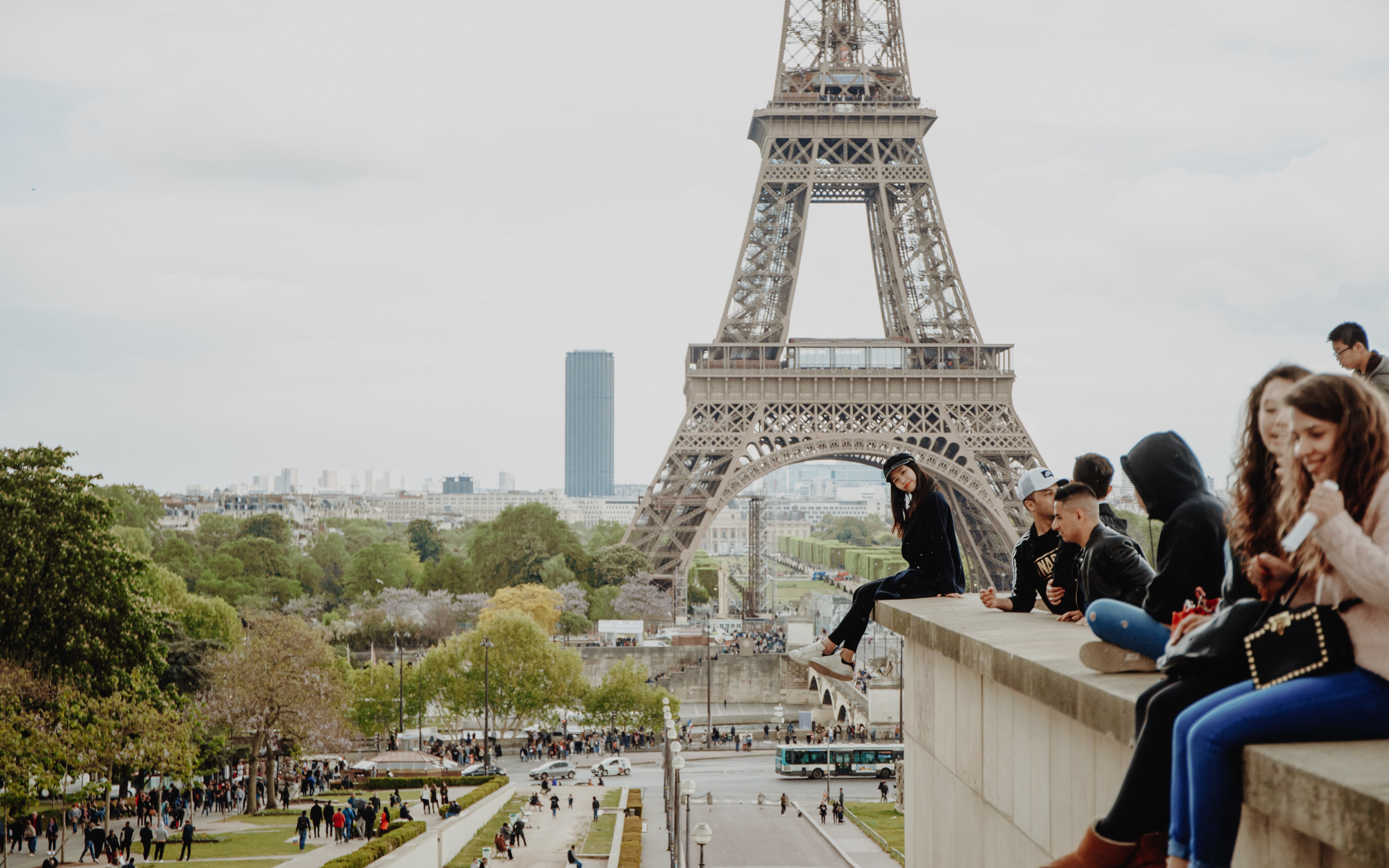 Image of lady in front of the Eiffel Tower in Paris.