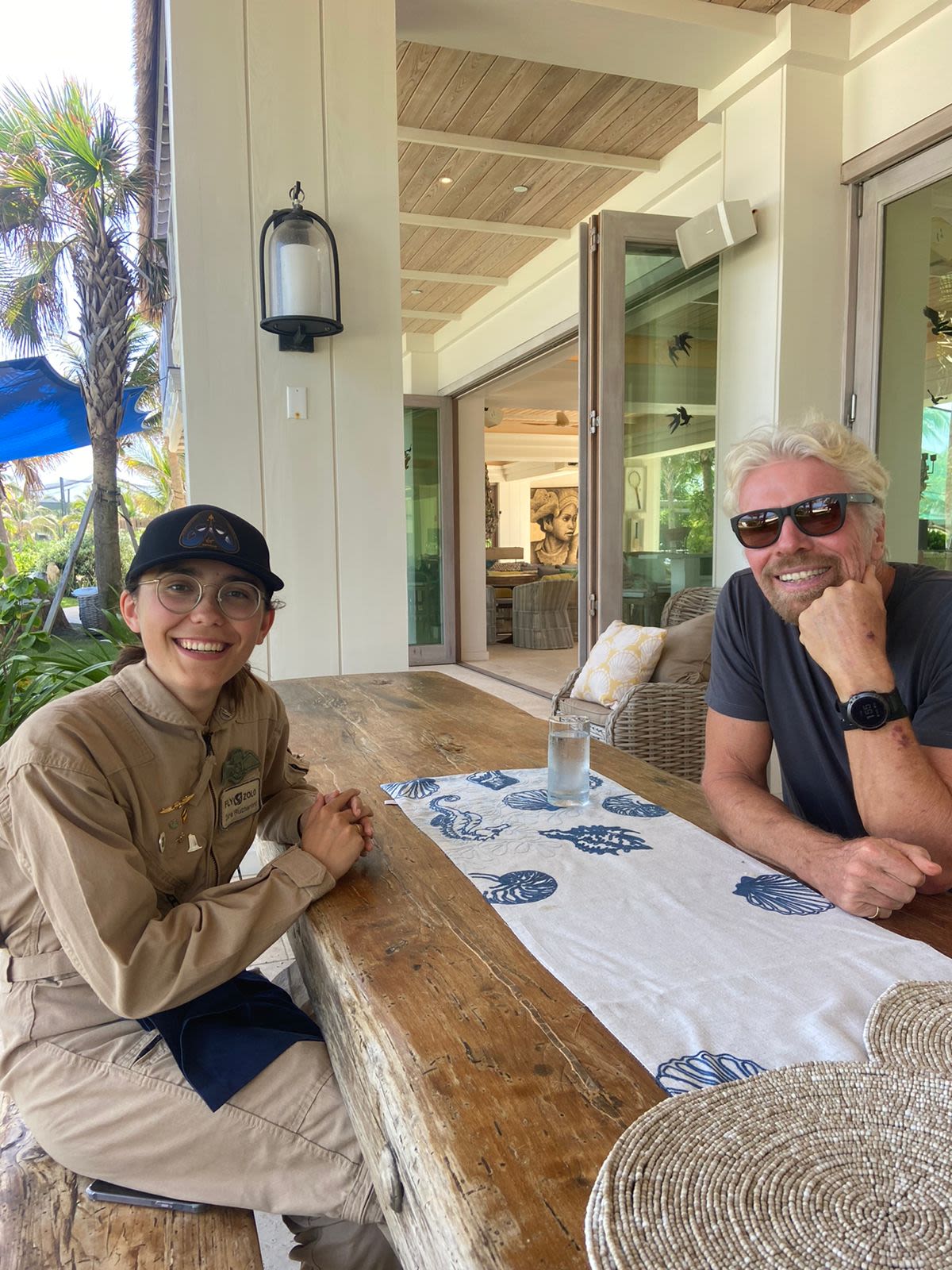 Richard Branson smiles with Zara Rutherford on Necker Island