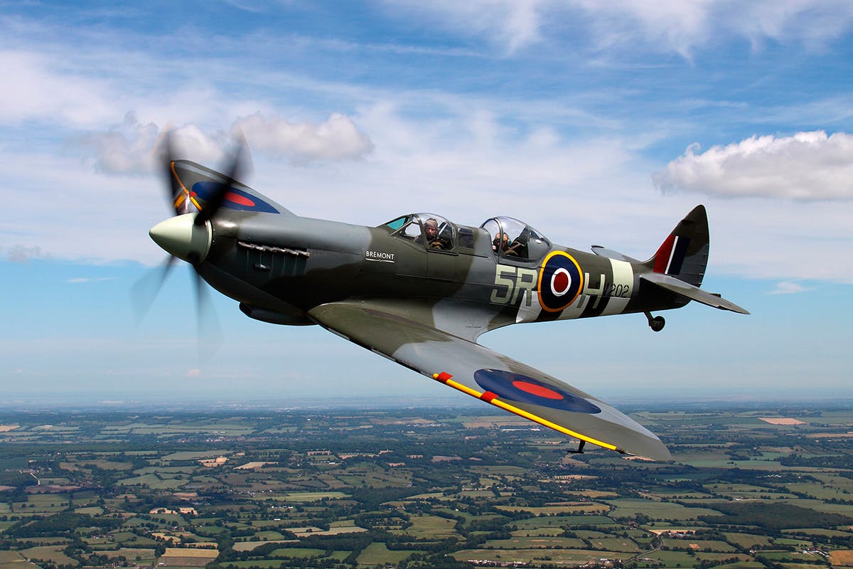 WWII Spitfire flying through the sky