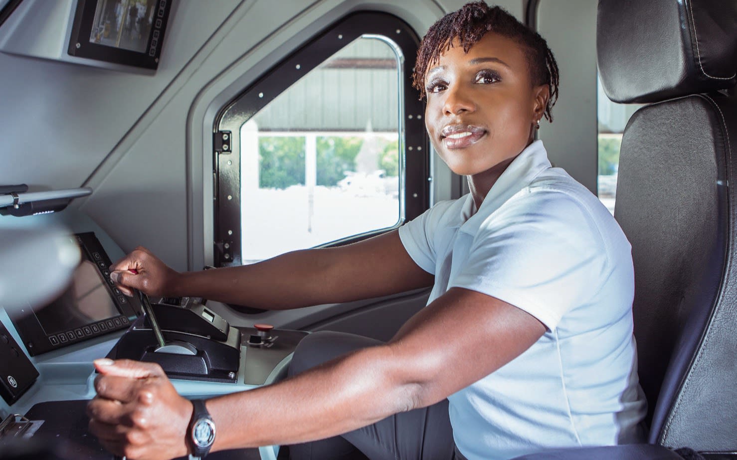 Kim Cameron in the drivers seat of a train