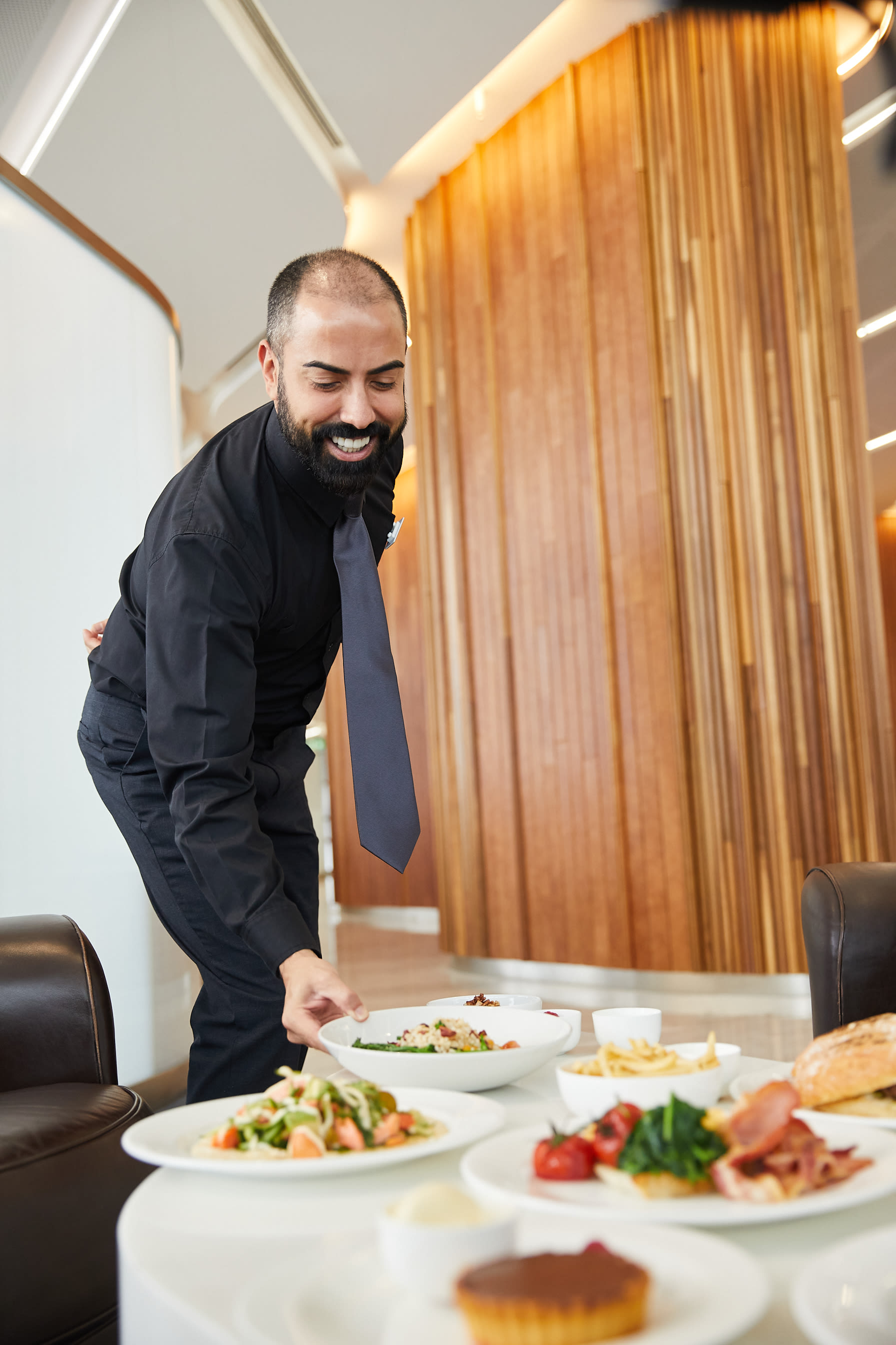 Virgin Australia airpot lounge employee smiling