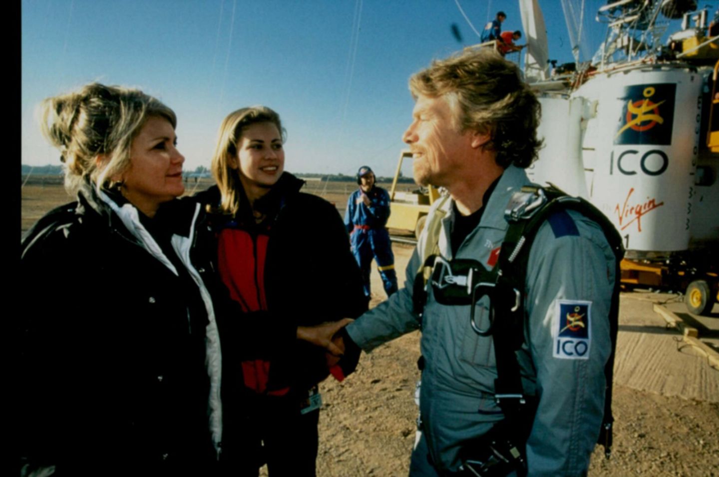 Joan Branson with Holly Branson and Richard Branson in front of a hot air balloon