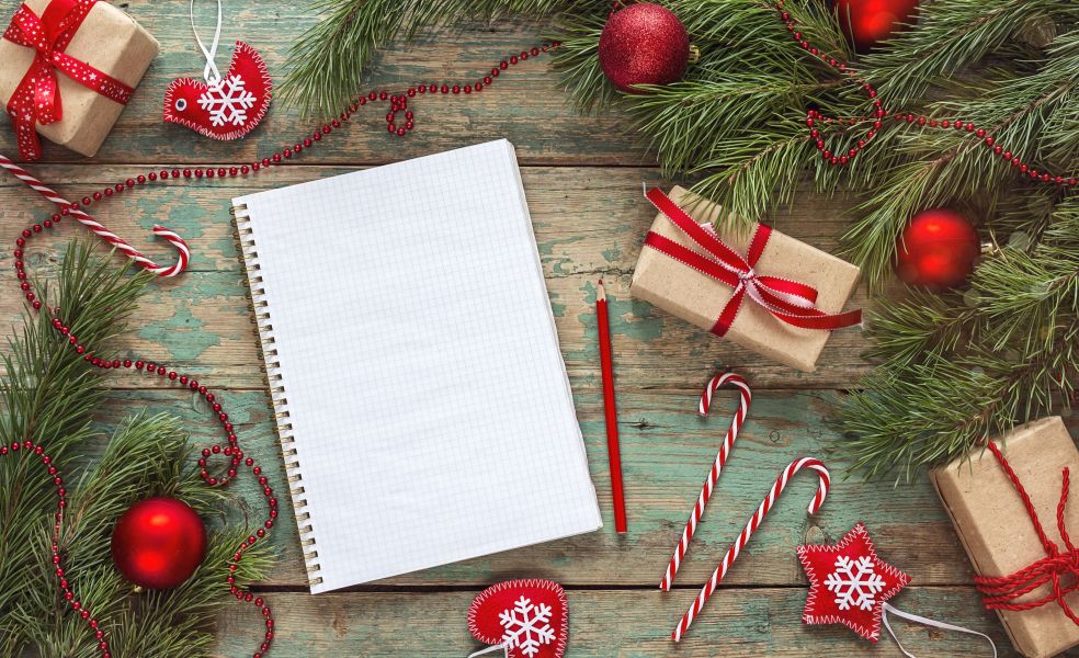 A notepad with Christmas background