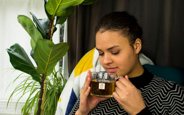 A woman drinking herbal tea