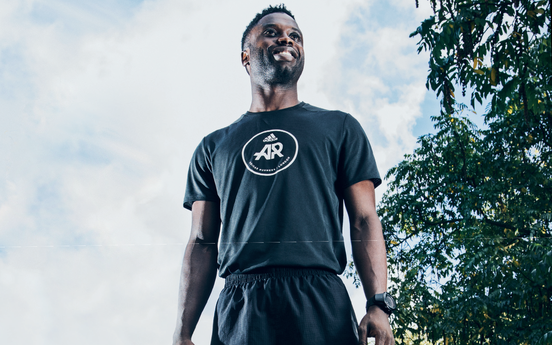 Virgin StartUp team member Ayo Dada wearing running gear, looking into the distance