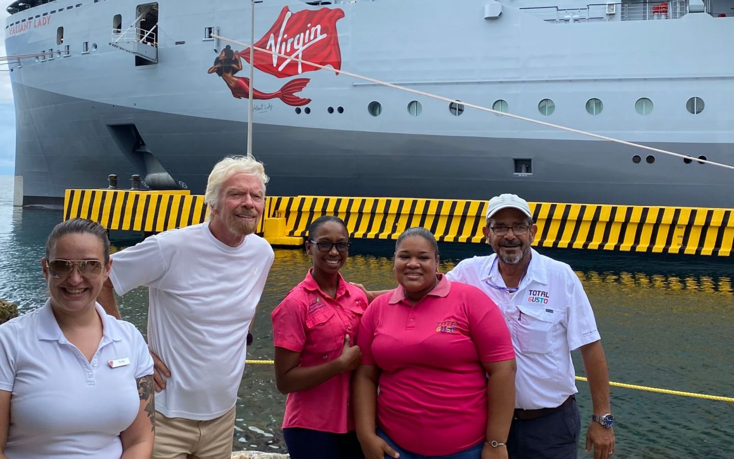 Richard Branson with Virgin Voyages team mates in Honduras
