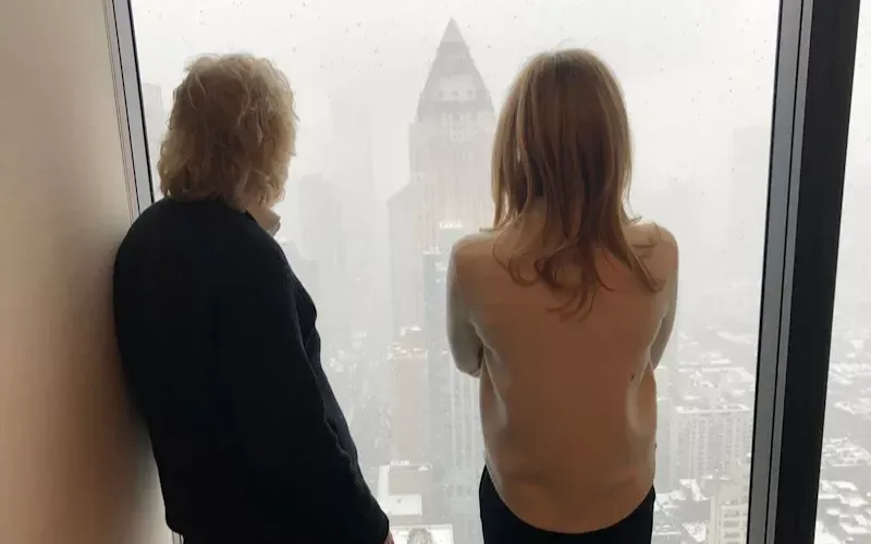 Richard and Holly Branson look out over New York from a hotel window, their backs to the camera