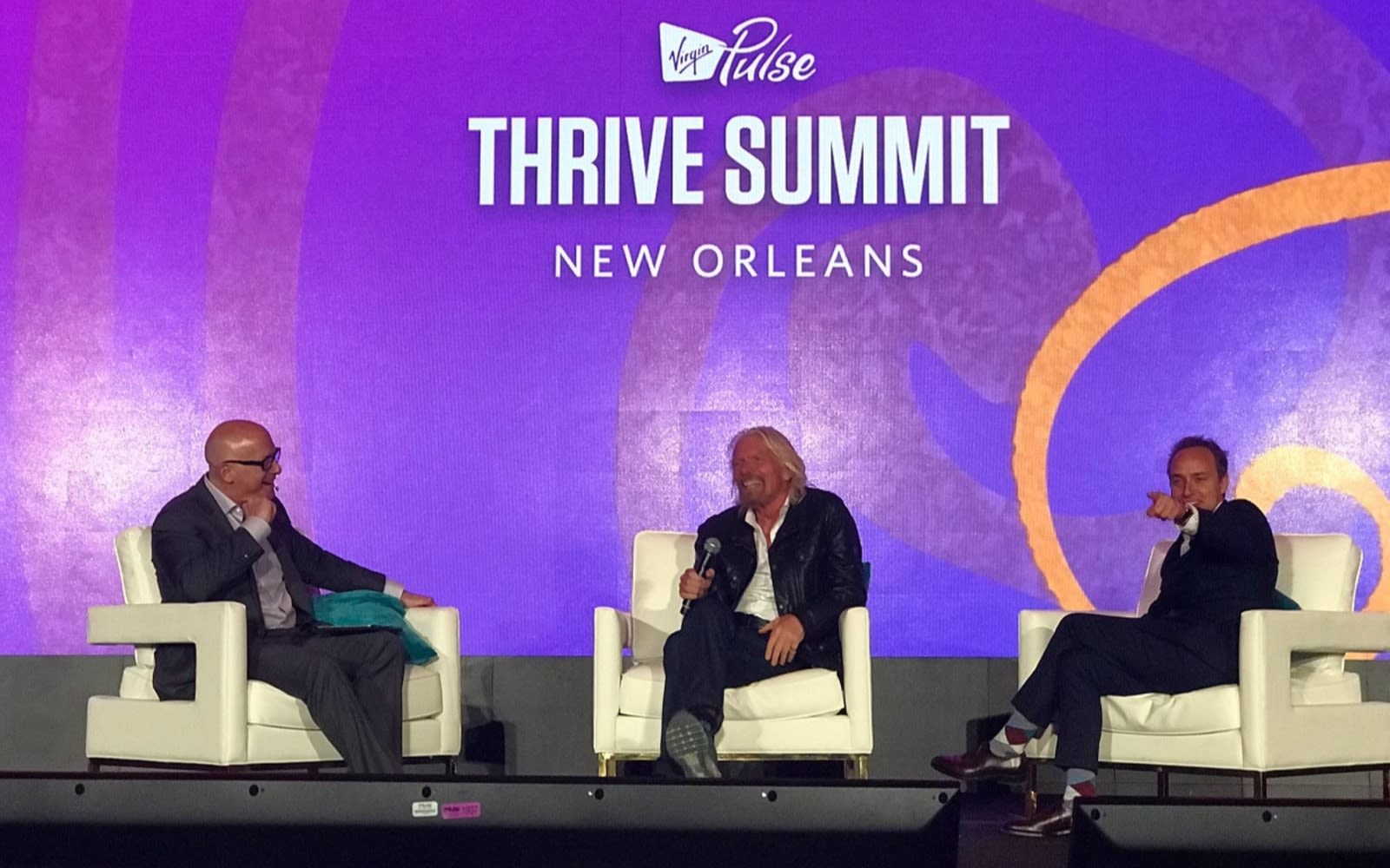 Dave Osborne, Richard Branson and Mark Jeffries on stage at the Virgin Pulse Thrive Summit in New Orleans
