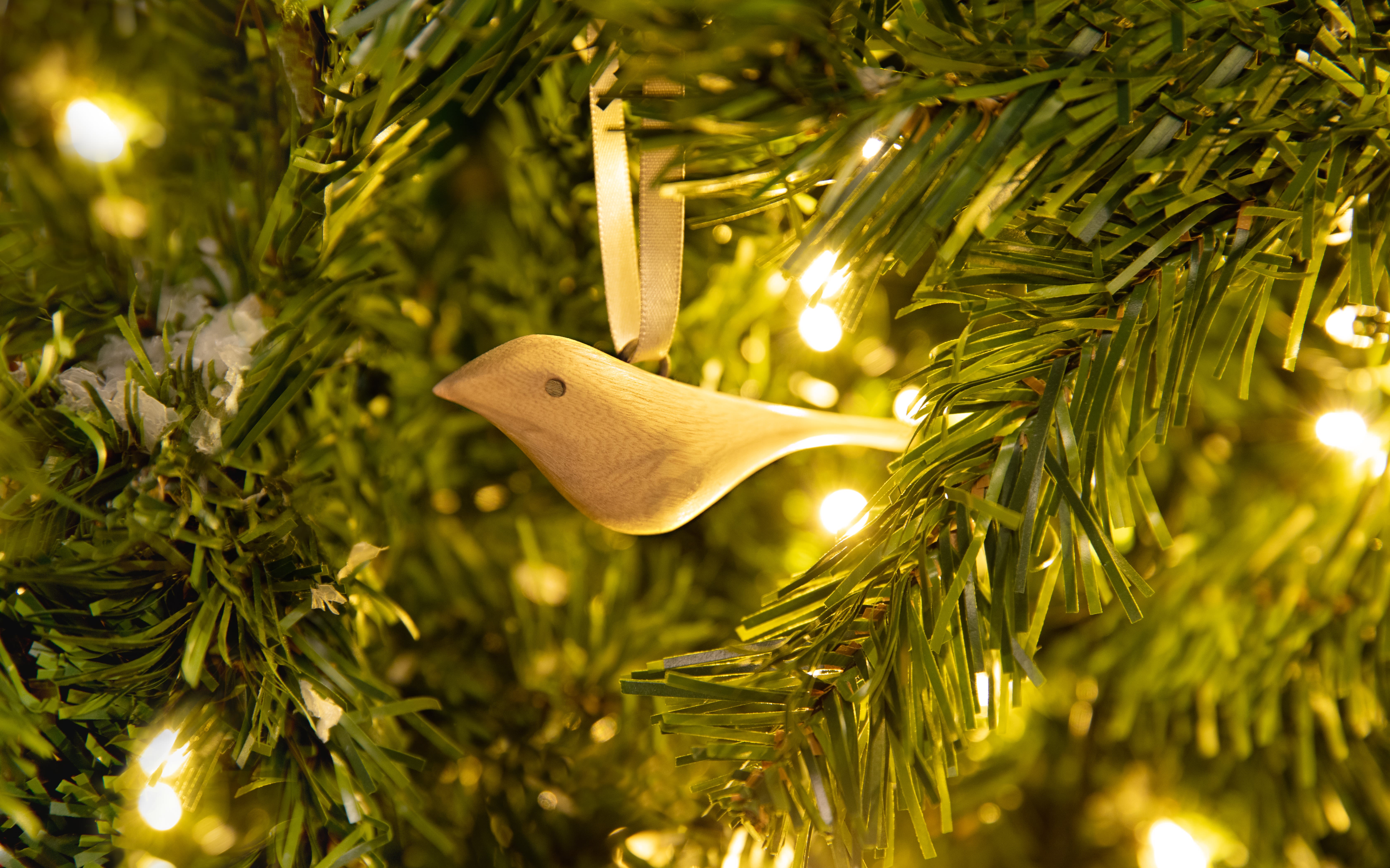 MADE51 peaceful dove ornament hanging from a tree