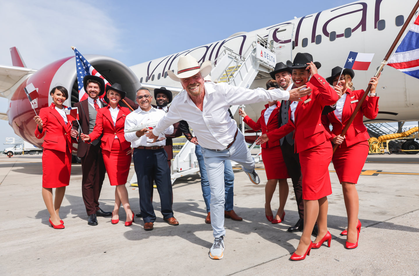 Richard Branson with all the crew on Virgin Atlantic flight to Austin