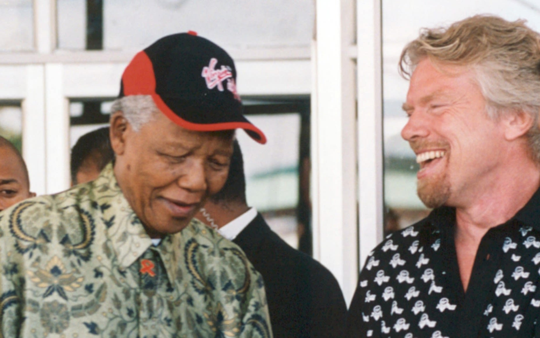 Richard Branson laughing with Nelson Mandela