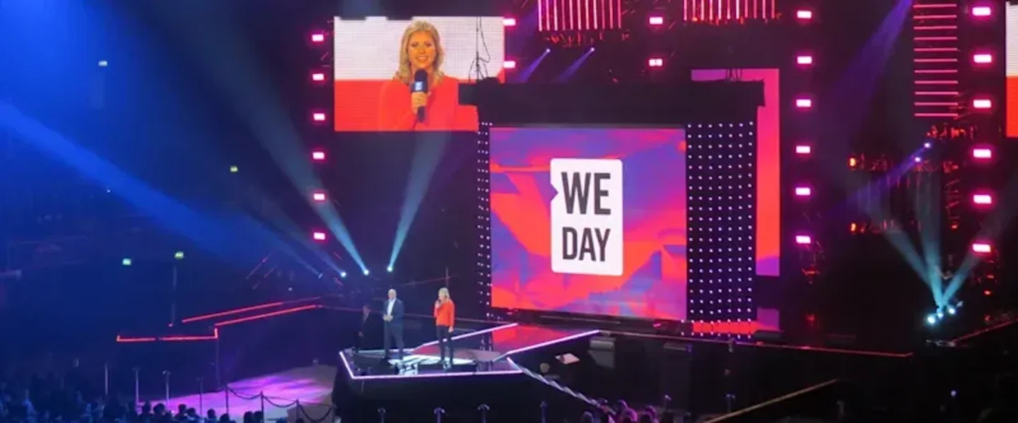 Holly Branson standing on the WE Day Stage in London 2014