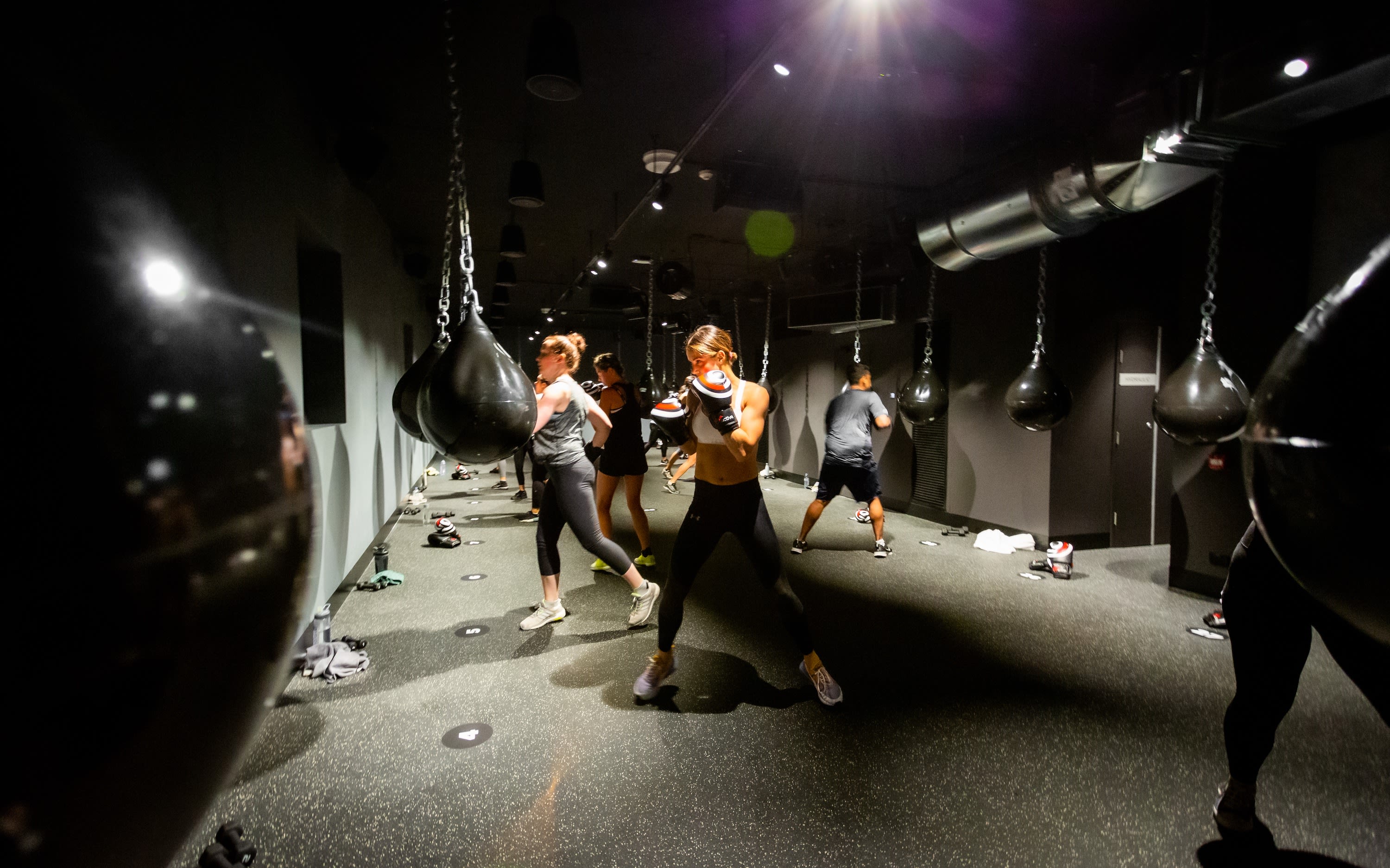 People practice boxing in the boxing studio at Bondi Junction