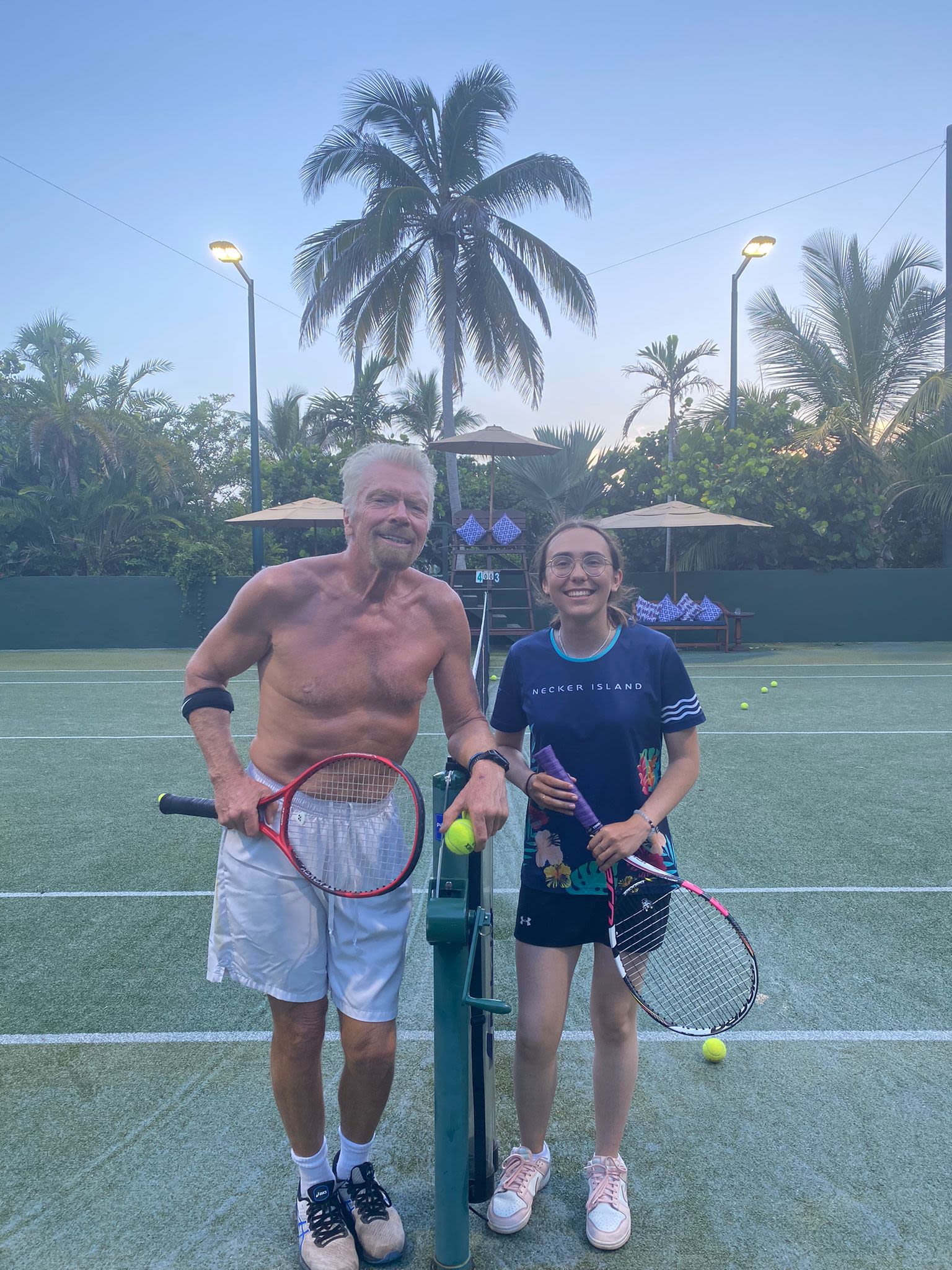 Richard Branson playing tennis with Zara Rutherford on Necker Island