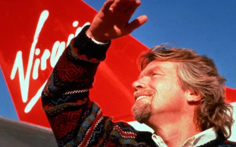 Richard Branson and the tail of a Virgin Atlantic plane in the 1980s