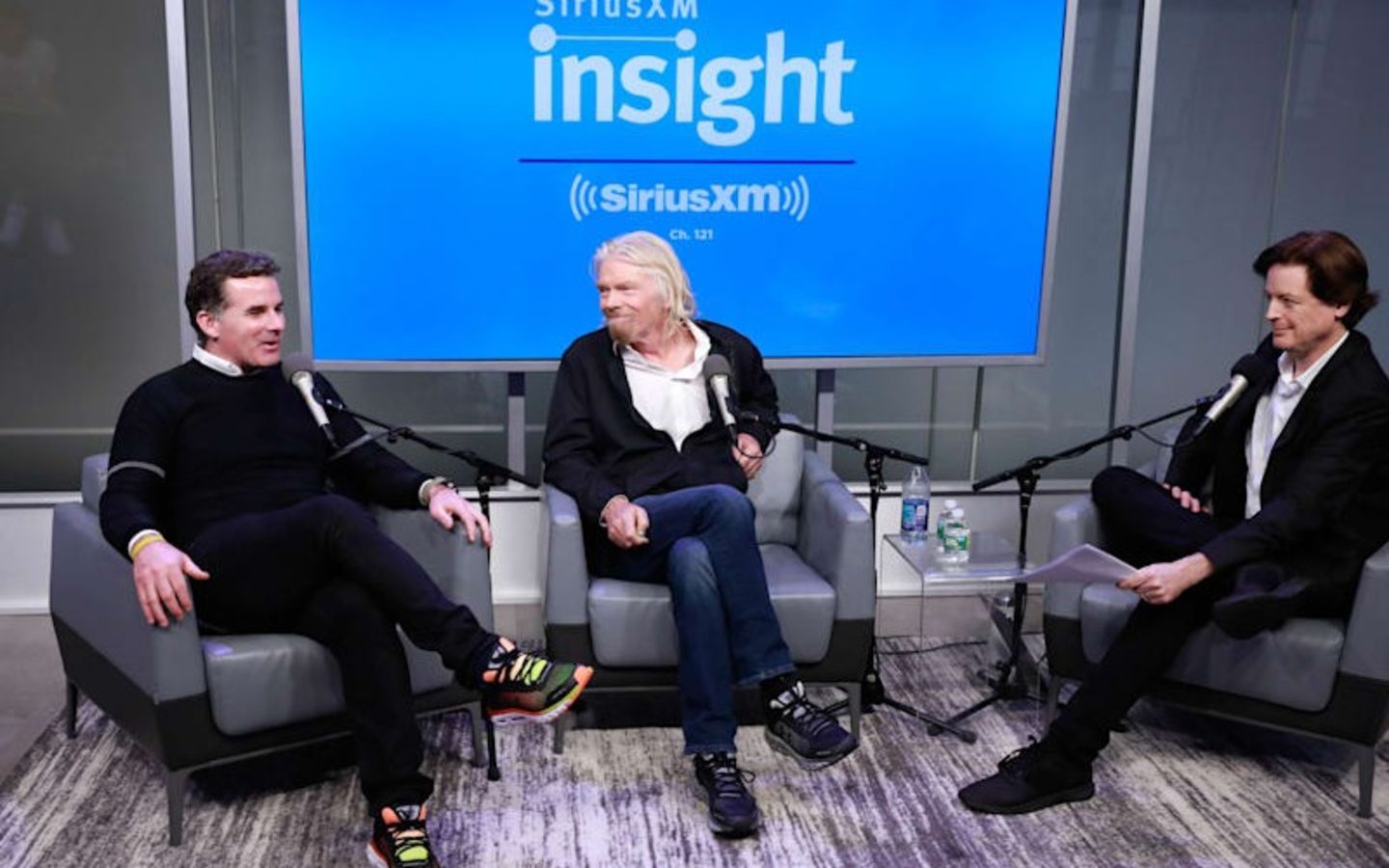 Richard Branson, Kevin Plank and John Fugelsang sitting and talking on SiriusXM radio show Learning with Richard Branson