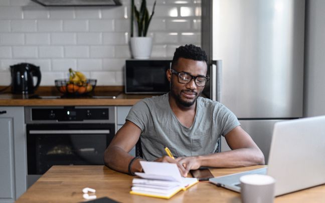 A black man working from home