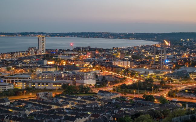An aerial view of Swansea at night.