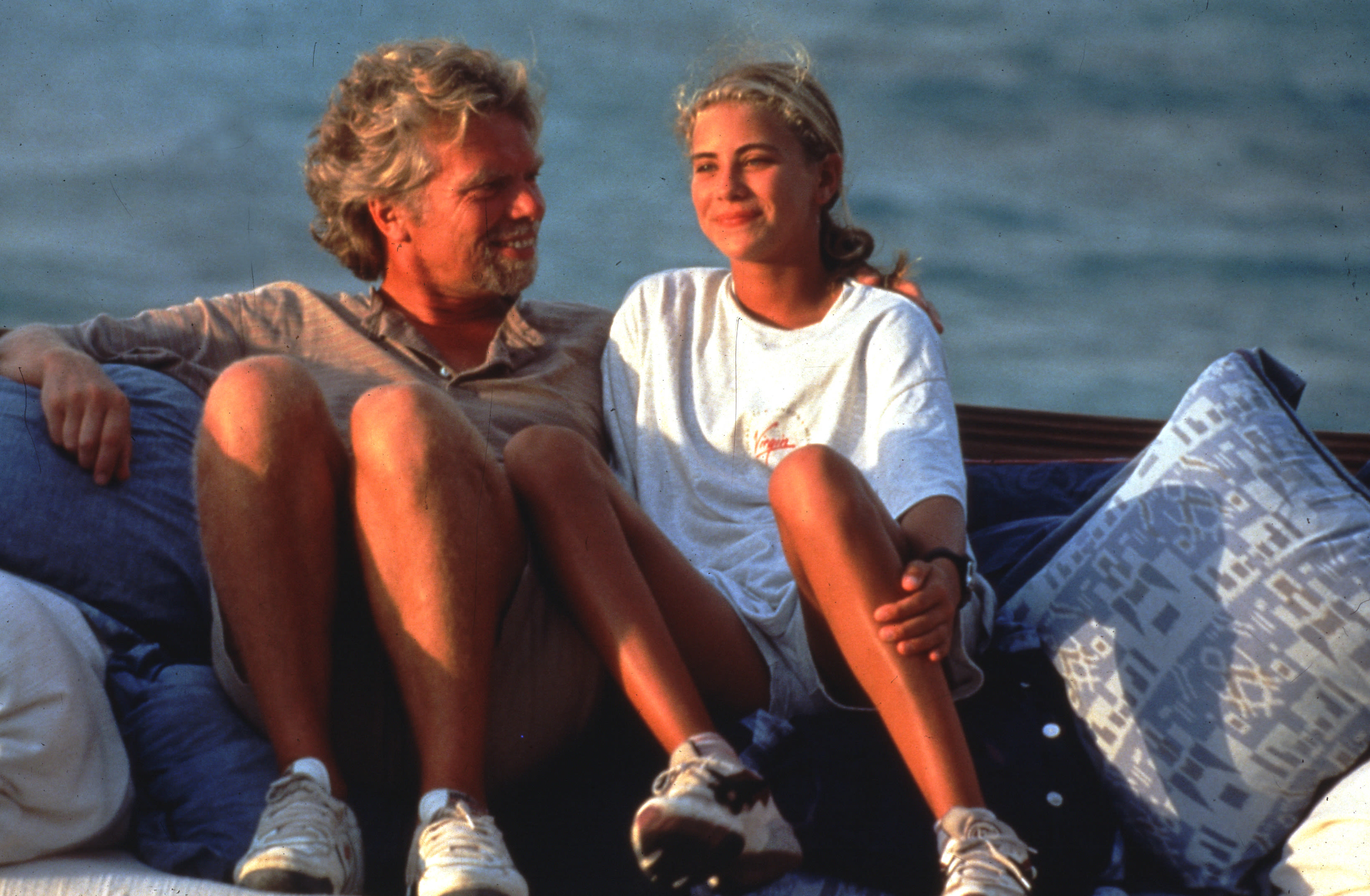 Richard Branson and Holly Branson smiling by the water