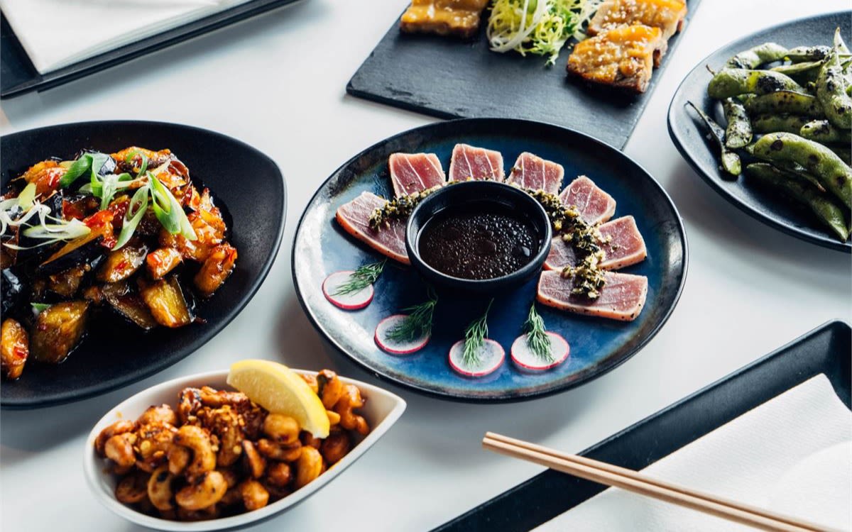 Image of a spread of small dishes at Inamo Covent Garden.