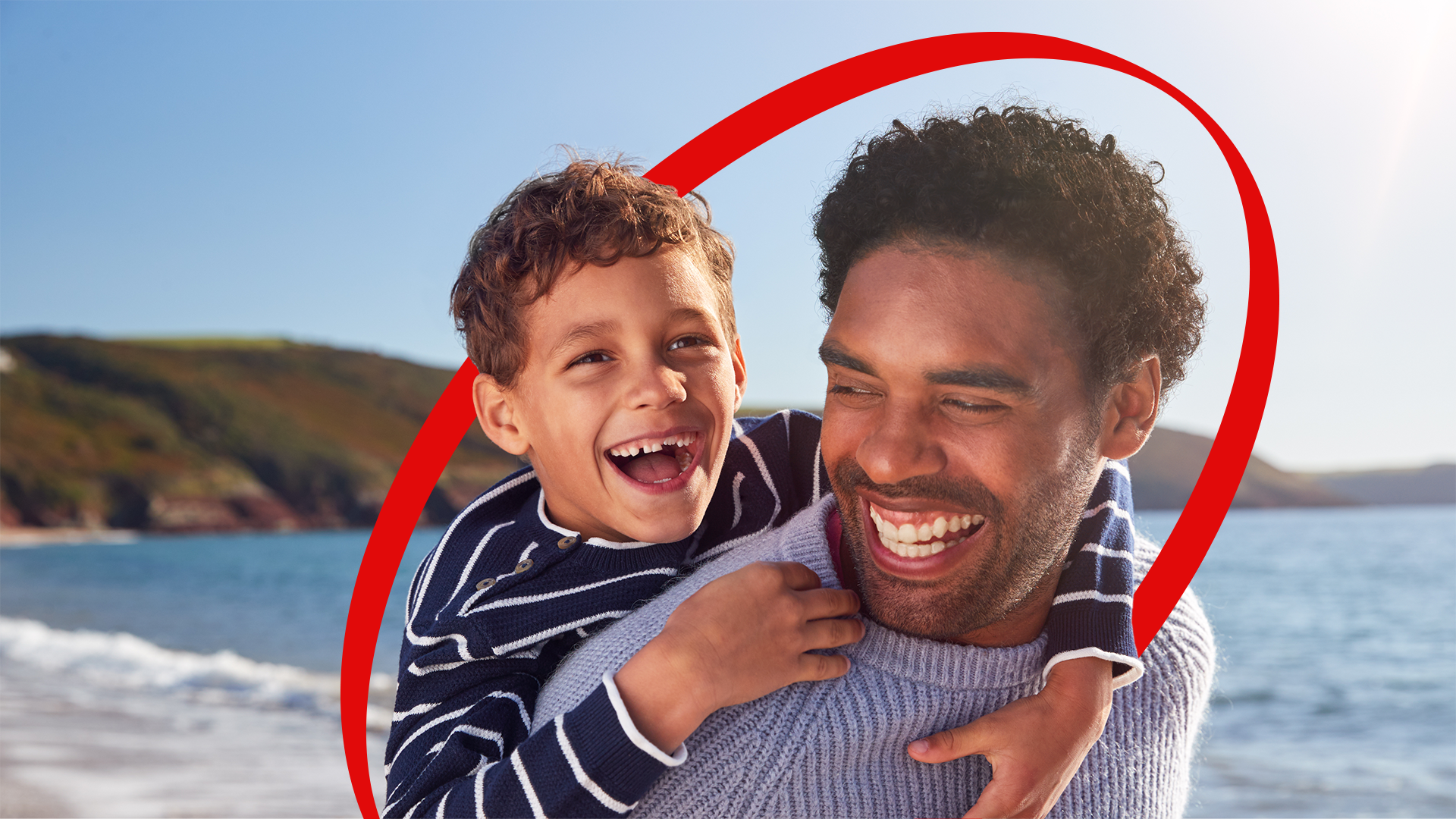 Father carrying son on shoulder on holiday with Red inner circle 