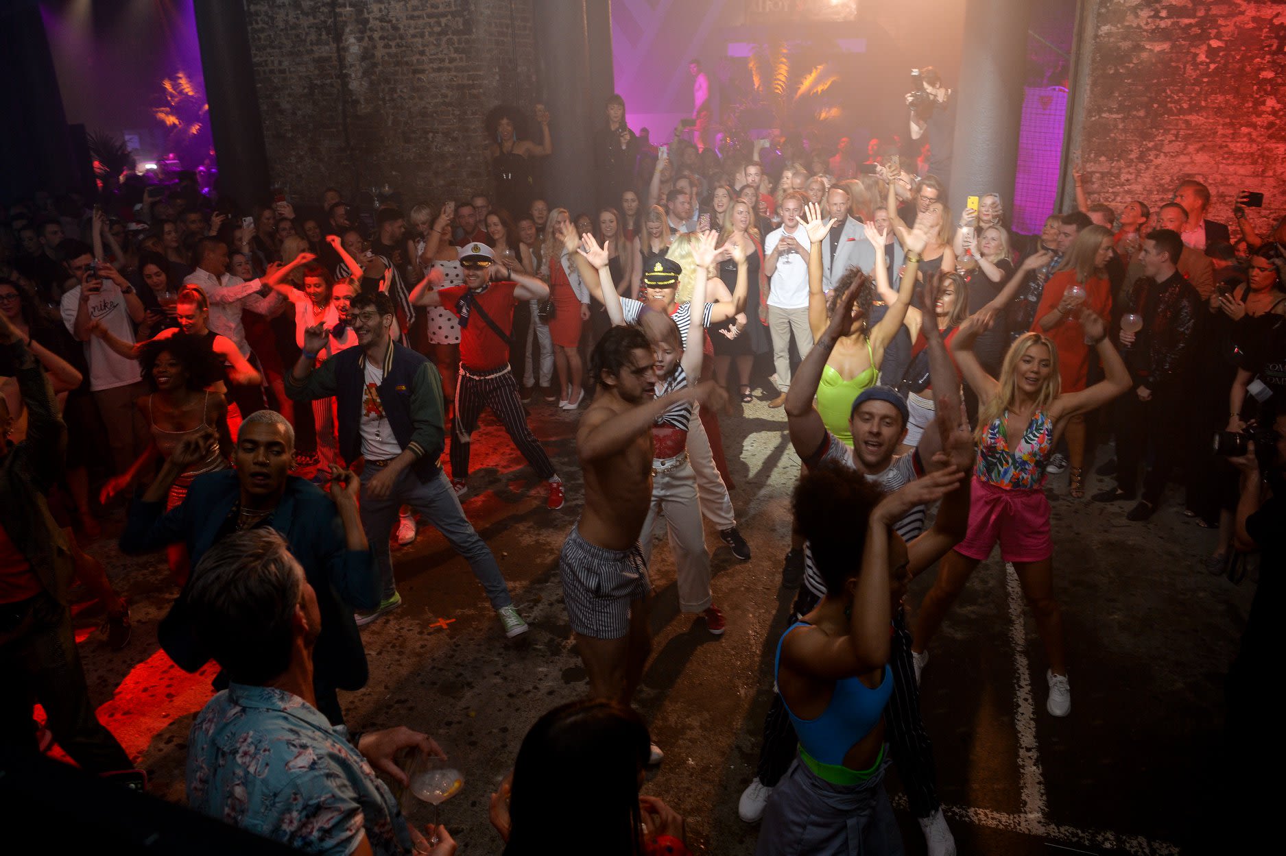 people dancing at the Scarlet Night party hosted by Virgin Voyages in London 2019