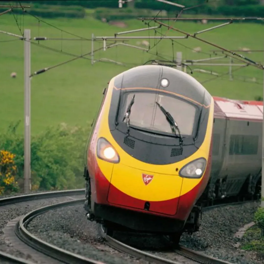 A Virgin Train Pendolino in motion on a railway track