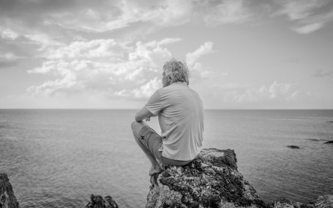 Richard Branson on Necker Island looking into the ocean