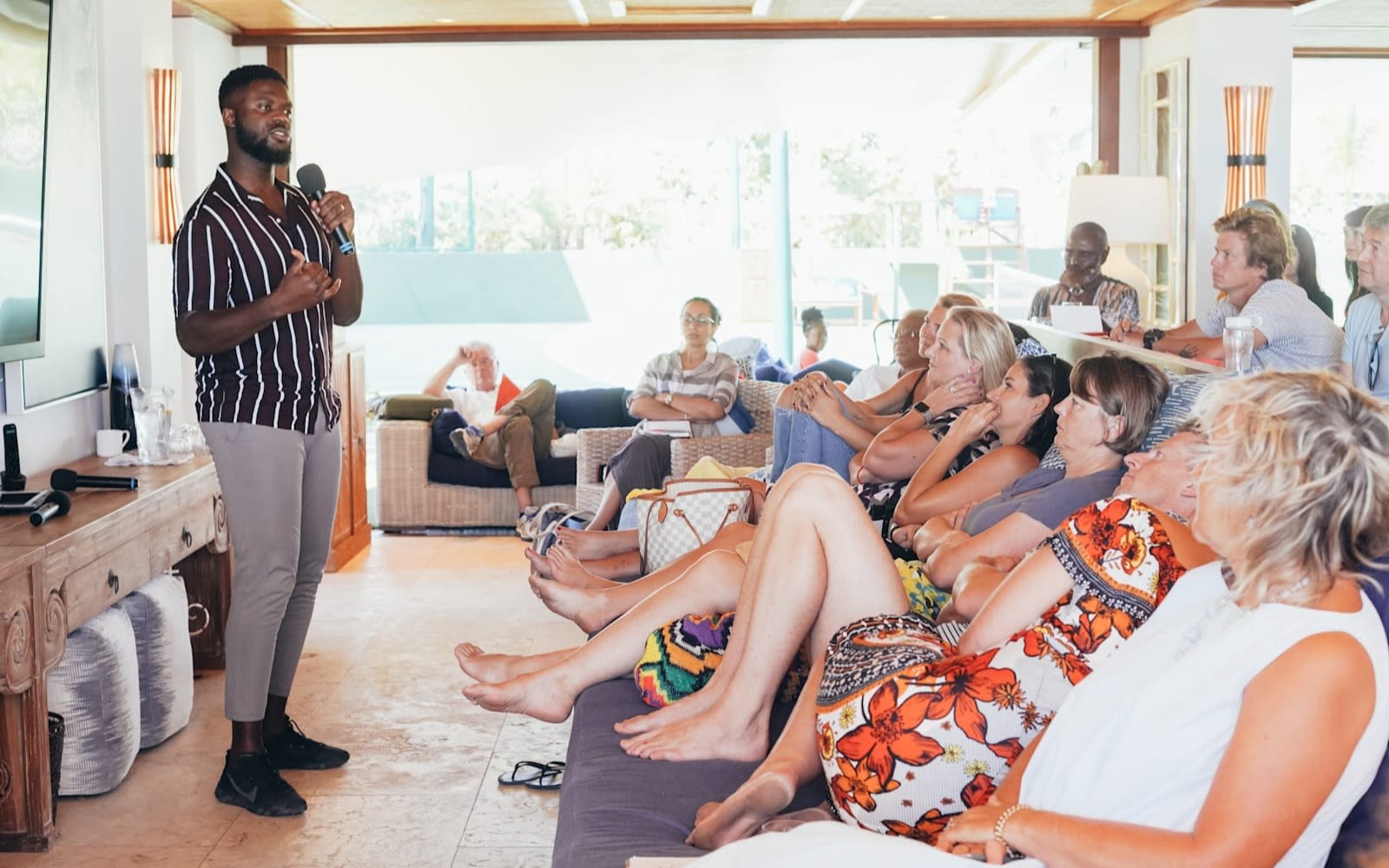 Karl Lokko speaks in front of a crowd at a Virgin Unite event