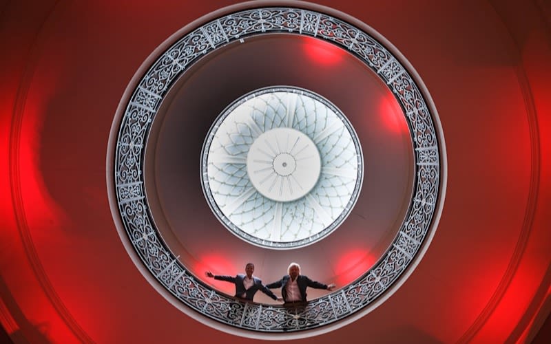 Richard Branson looks down from a balcony at Virgin Hotels Edinburgh