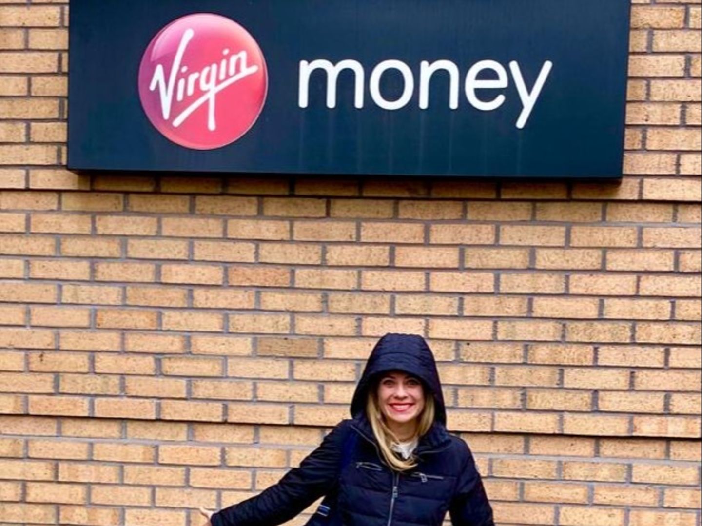 Holly Branson standing outside the Virgin Money office