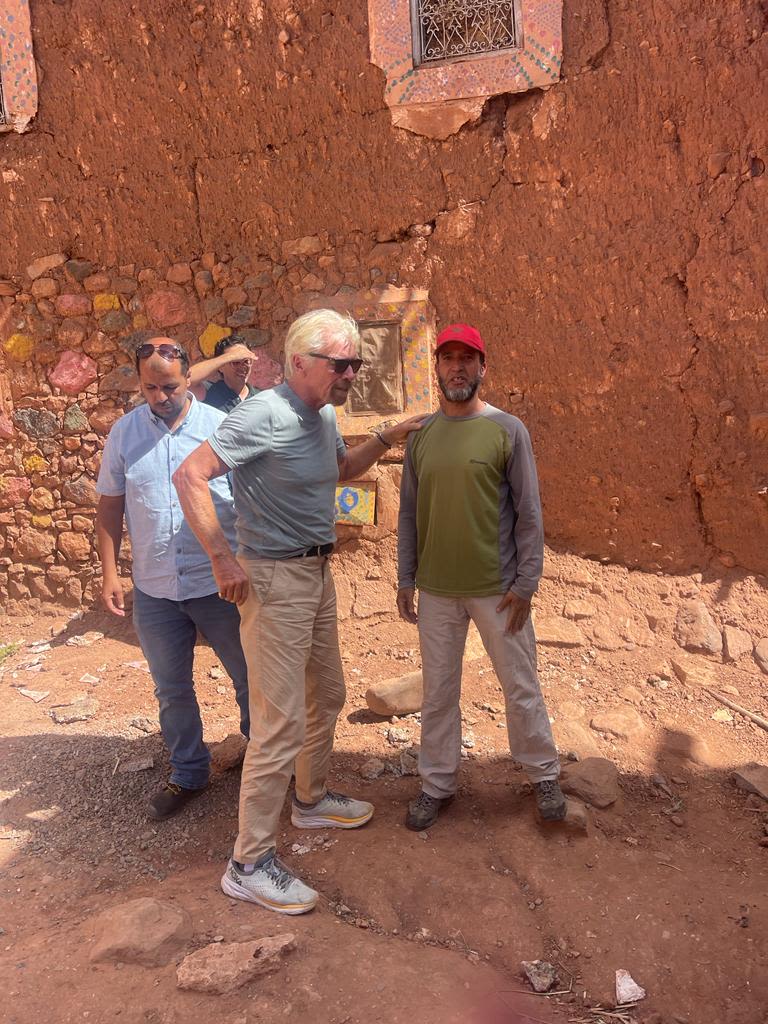 Richard Branson with a Moroccan man following the 2023 earthquake