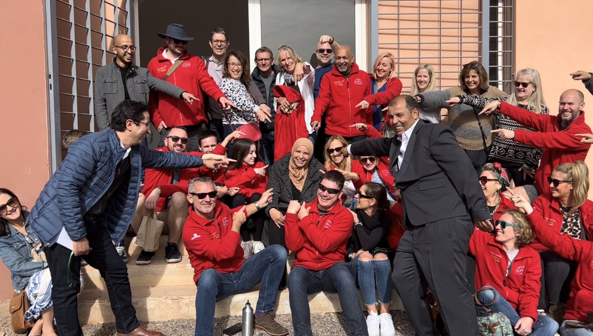 Fatima Gouansa, EBF Operations Manager, on the steps of the study centre with Virgin Atlantic's Climb Morocco 2022 group
