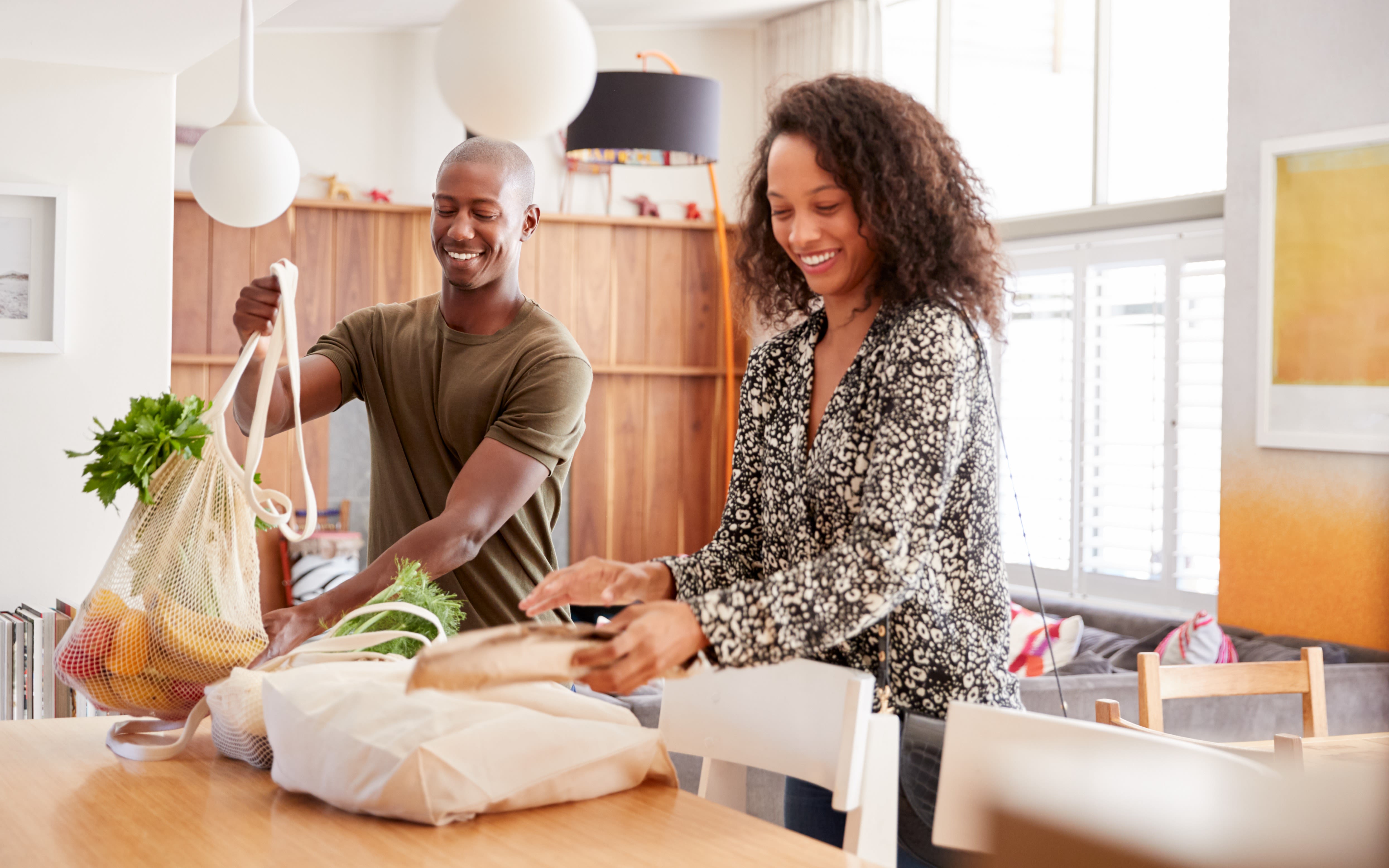 Image of a couple unpacking their shopping.