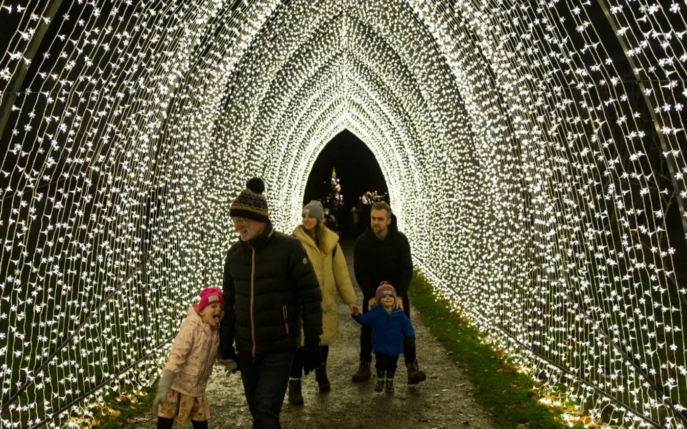 A family enjoys a winter event at the National Trust 