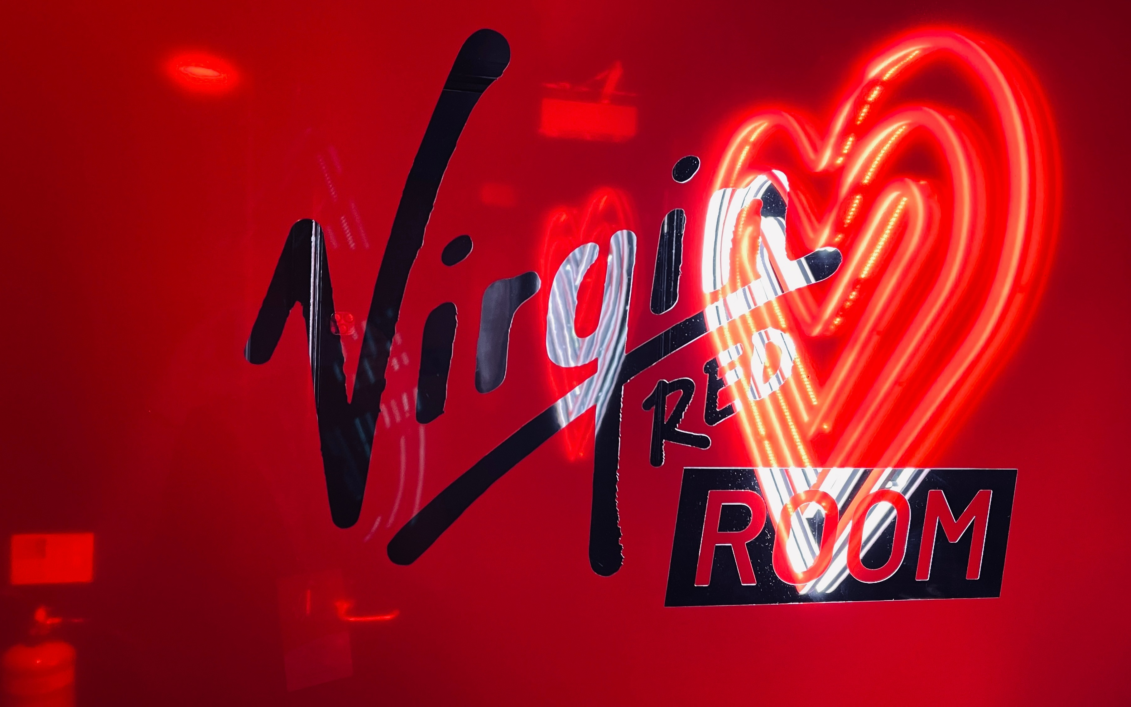 Image of the sign at the Virgin Red Room at Manchester's AO Arena.