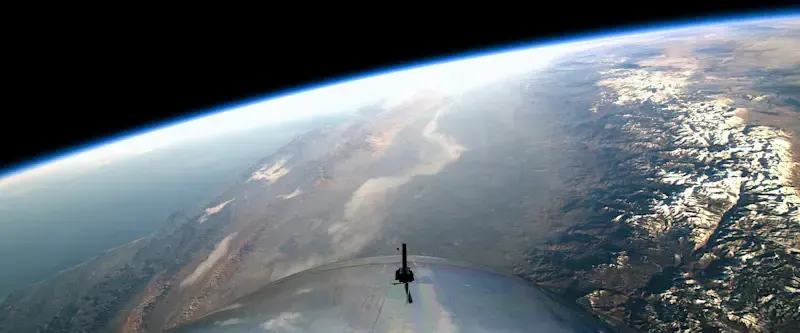 VSS Unity in space with Earth in the background