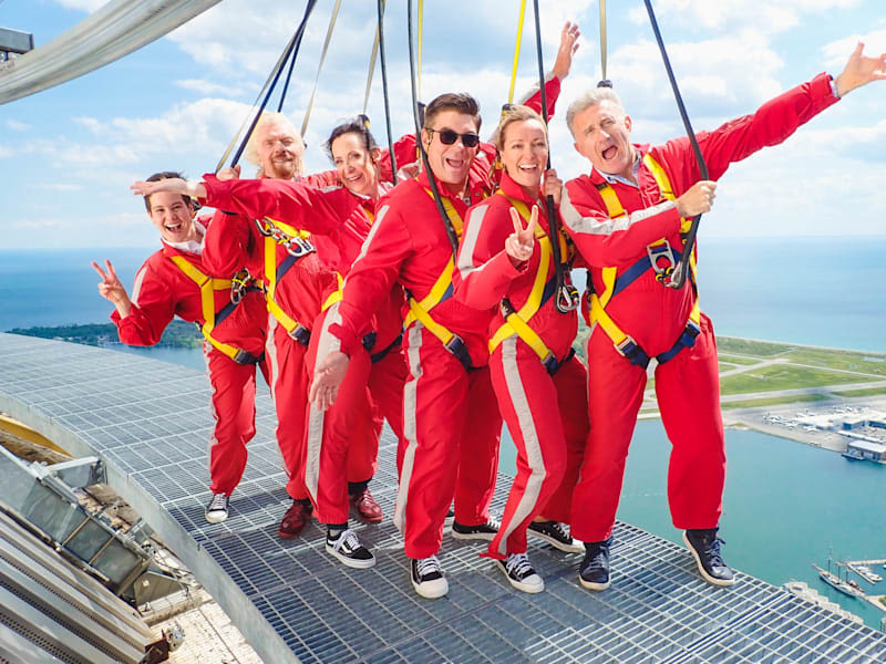 Richard Branson and Virgin Radio team completing the CN Tower Edge Walk in Canada 2019