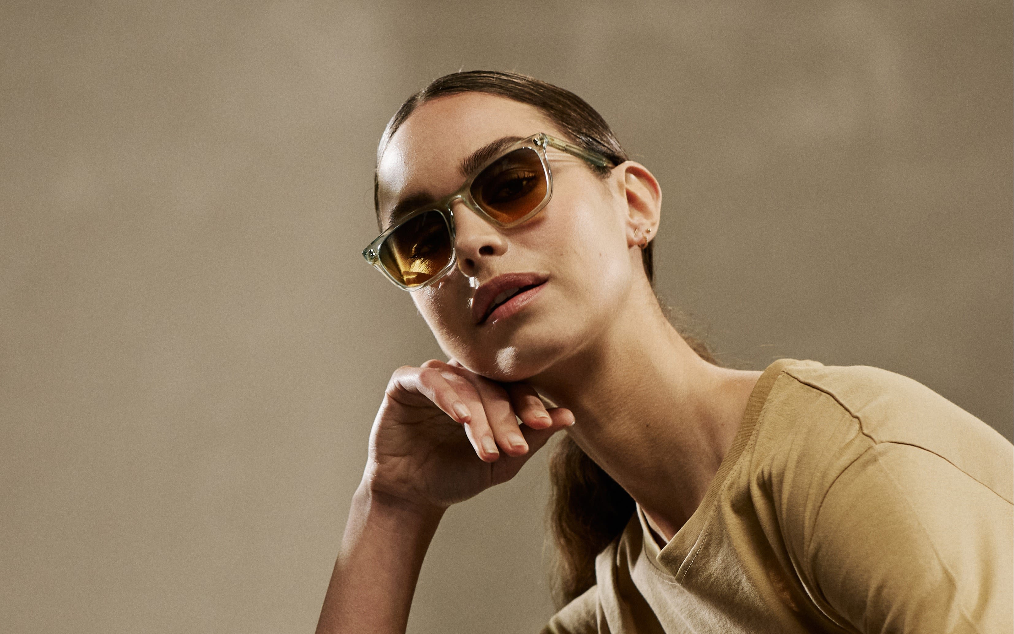 Woman poses in a pair of Tens sunglasses