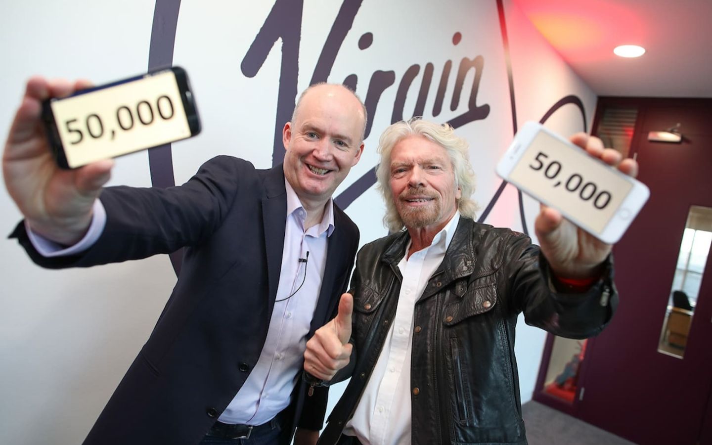 Richard Branson and Tony Hanway, CEO of Virgin Media Ireland, celebrate the 50,000th mobile customer