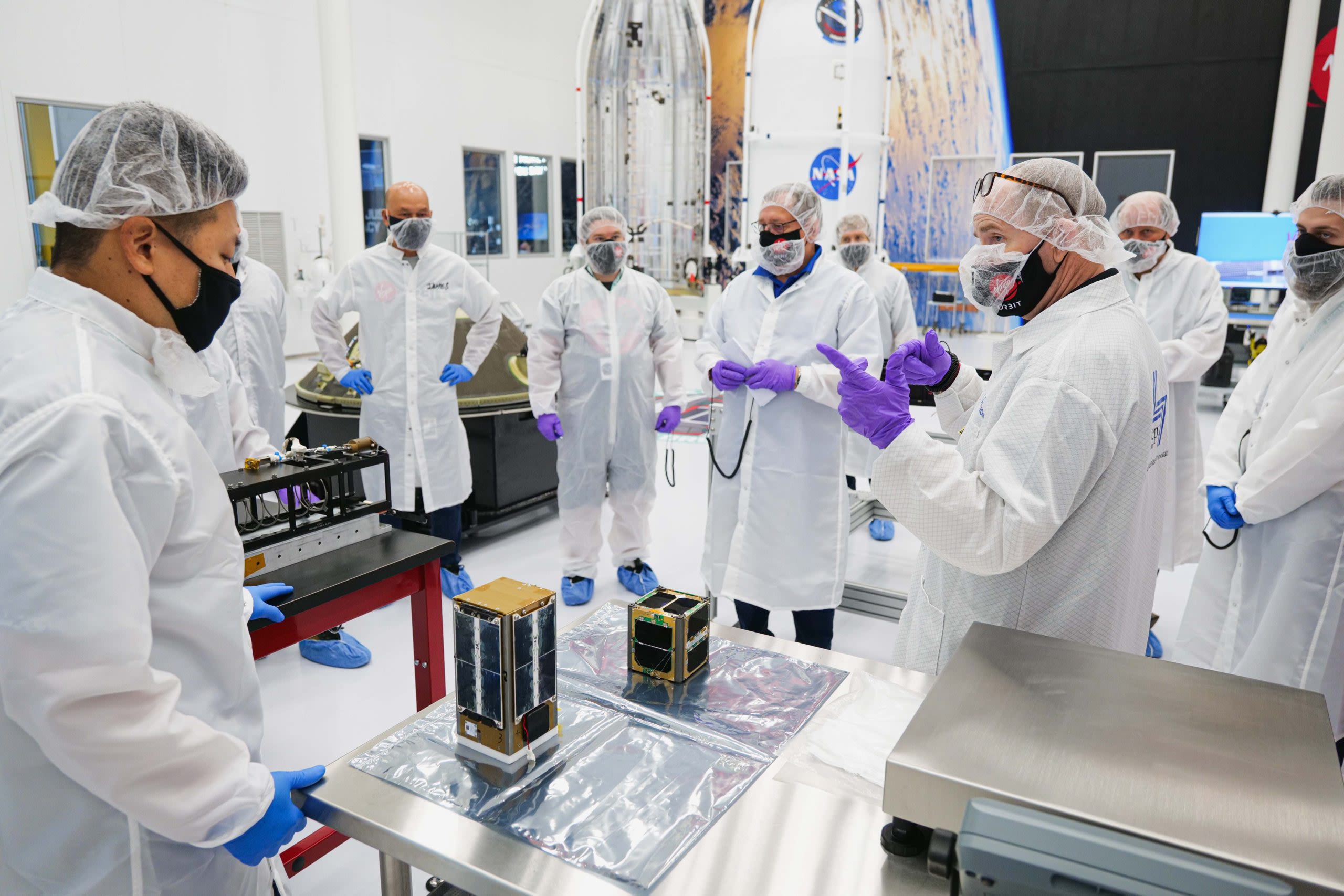 A team of Virgin Orbit technicians and payload customers conduct a final round of checkouts before integrating the spacecraft ahead of the company's Launch Demo 2 mission.