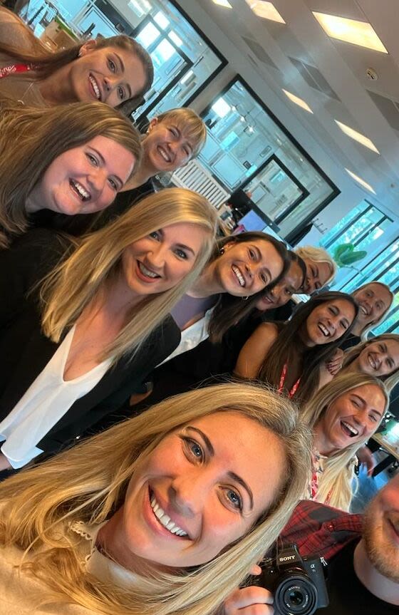 Holly Branson at Virgin's office in london with a group of employees