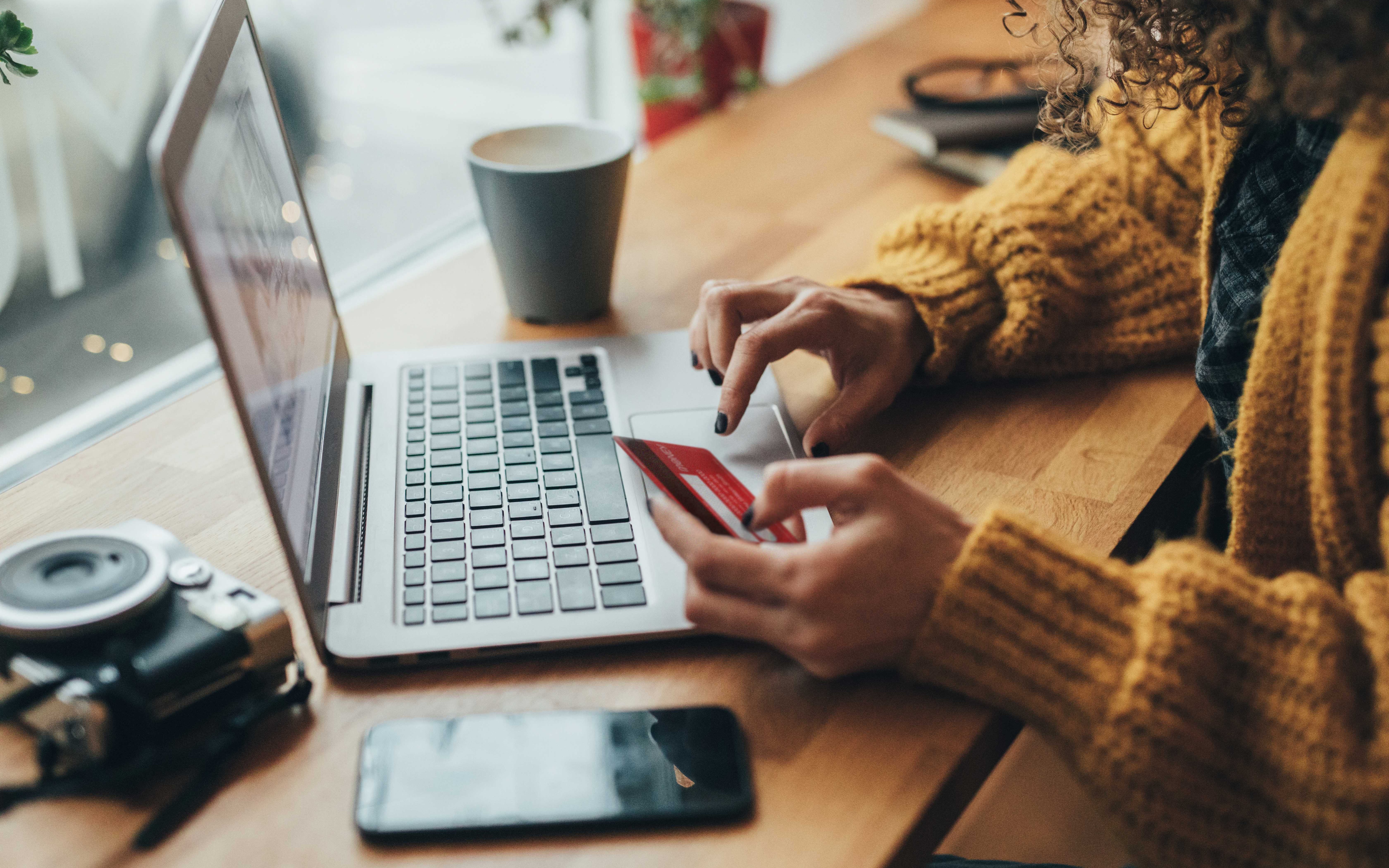 An image showing a woman shopping online 