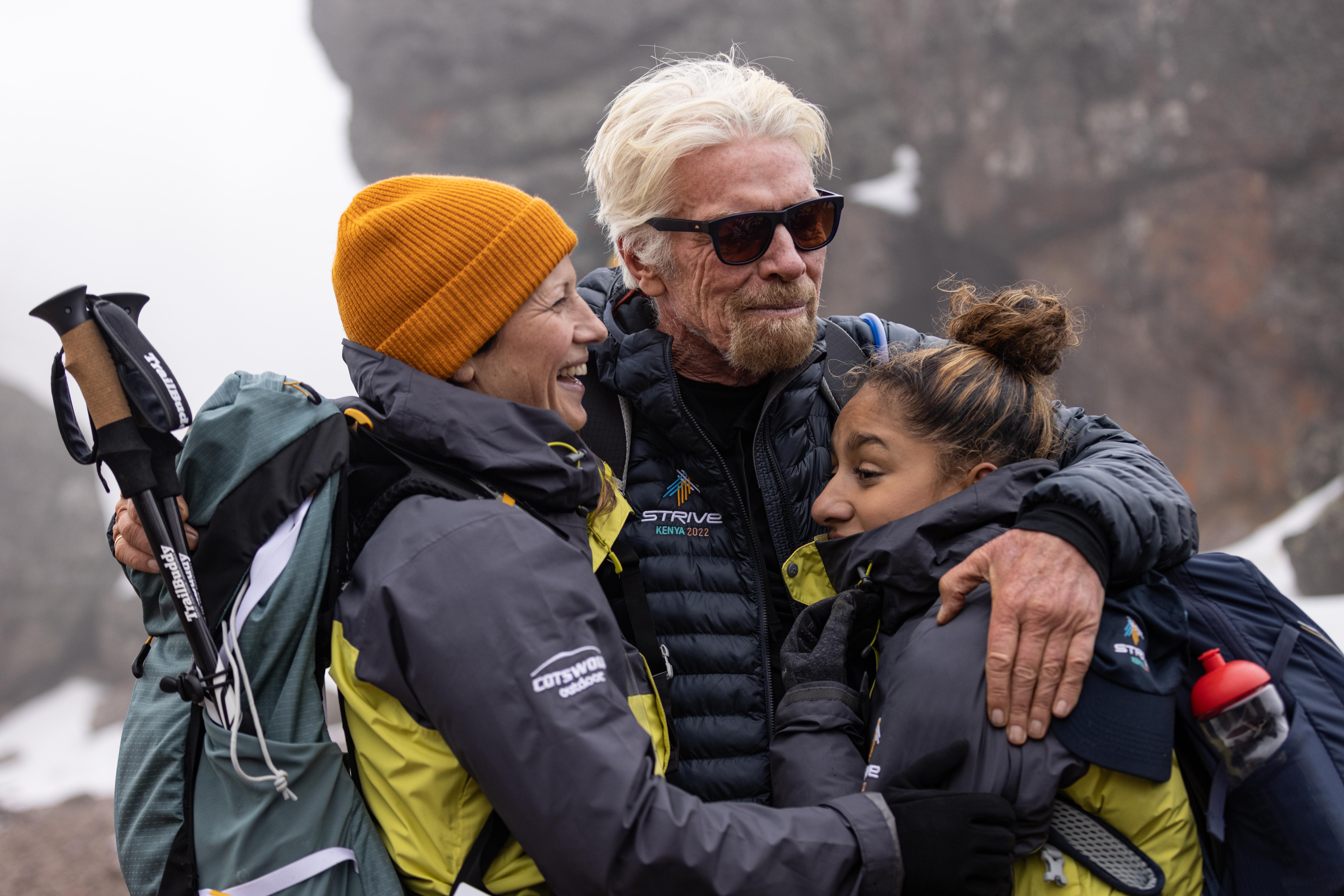 Richard Branson hugging friends on the 2022 Strive Challenge