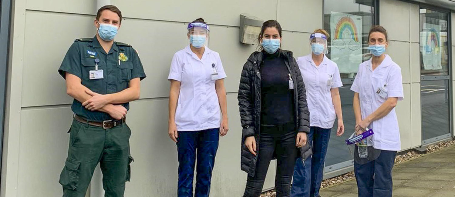 Sam Heenan (left) with other vaccination volunteers