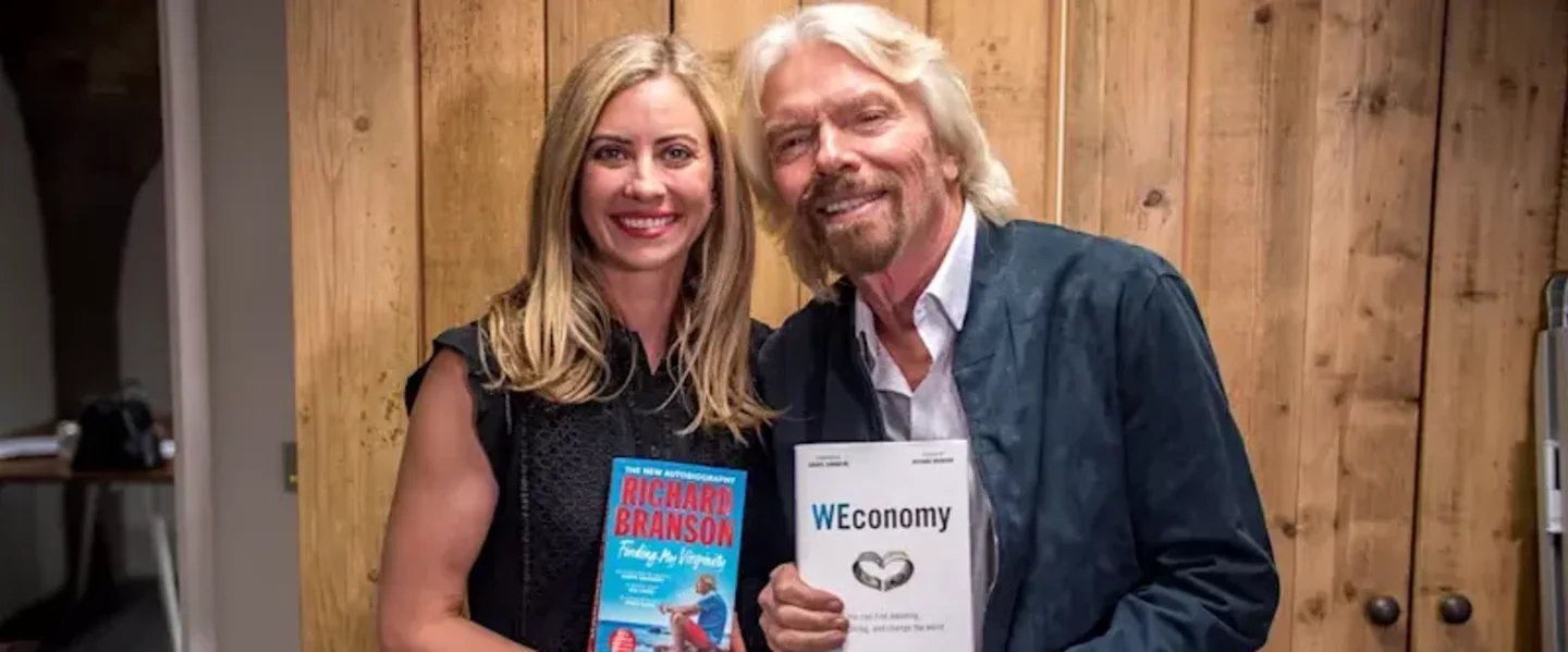 Holly Branson and Richard Branson pose with their books - Finding My Virginity and WEconomy