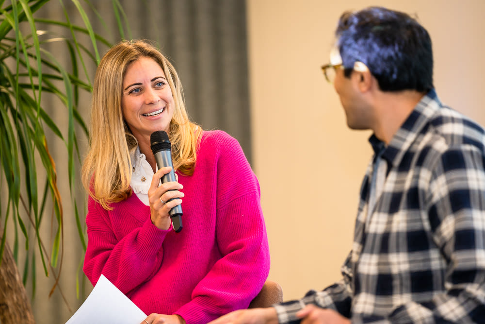 Holly Branson and Ajaz Ahmed_ speaking at an 100% Human At Work gathering