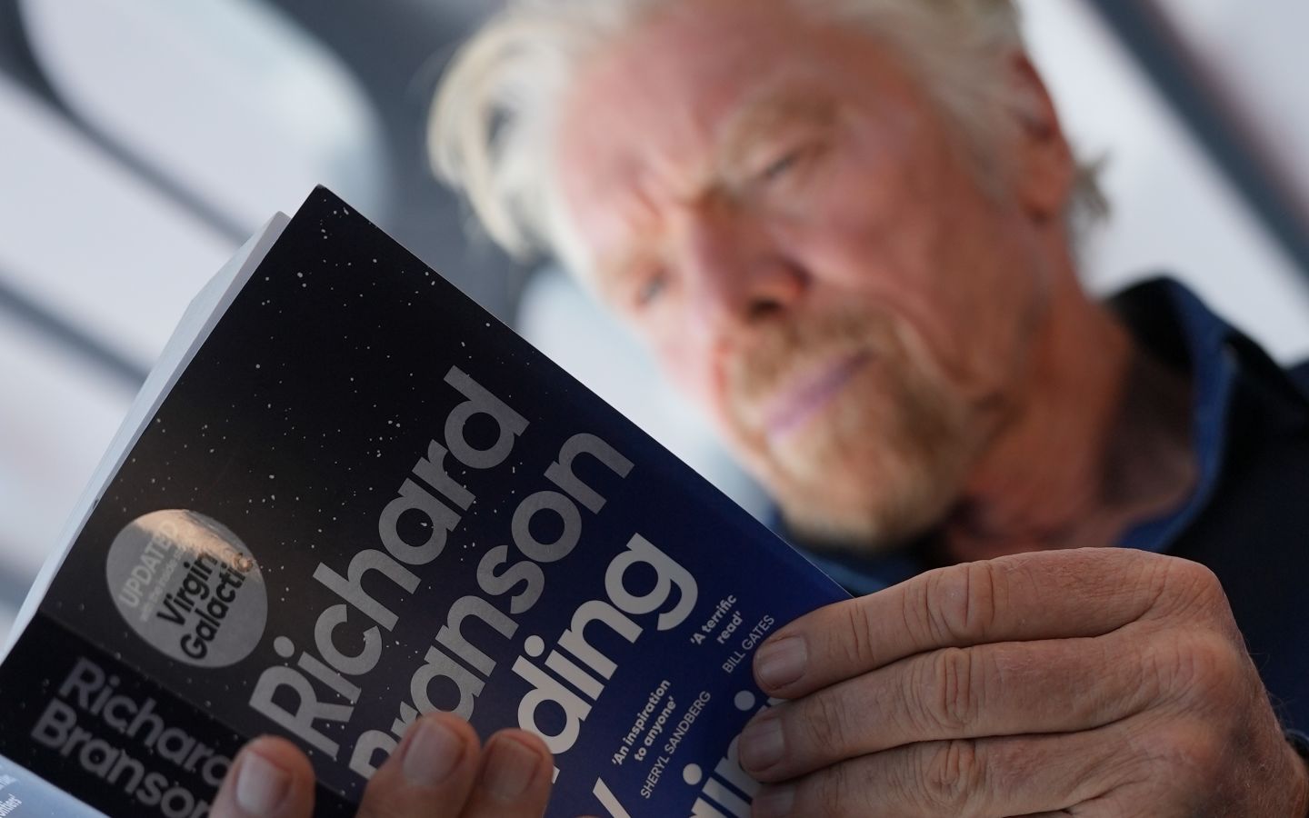 Richard Branson reading the updated version of my autiobiography, Finding My Virginity