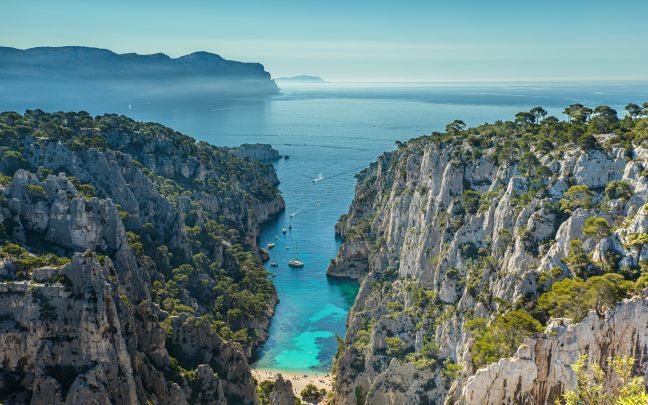 An image of mountains, a beach and the sea located in the Mediterranean 